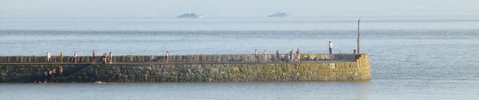 On another day the swimmers paused to watch two NATO boats sail away from the Cardiff summit. 